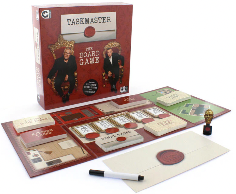 A board game with a pen and a stampDescription automatically generated