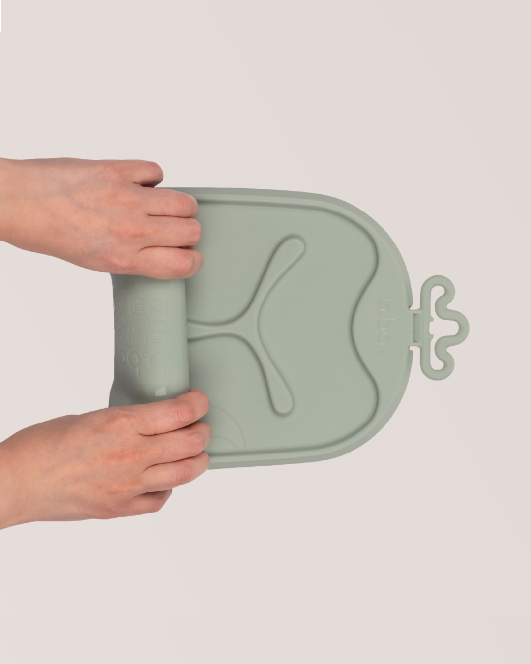 A person holding a plastic lidAI-generated content may be incorrect.