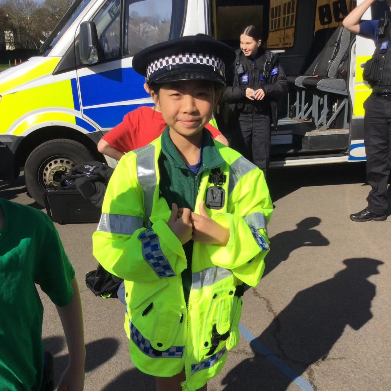 child with police jacket