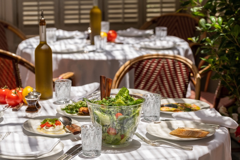 A dining table with a plate of foodDescription automatically generated