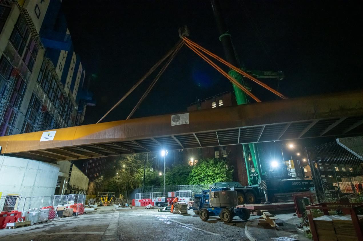 The 90 tonne steel bridge is lifted into position at Stockport Interchange