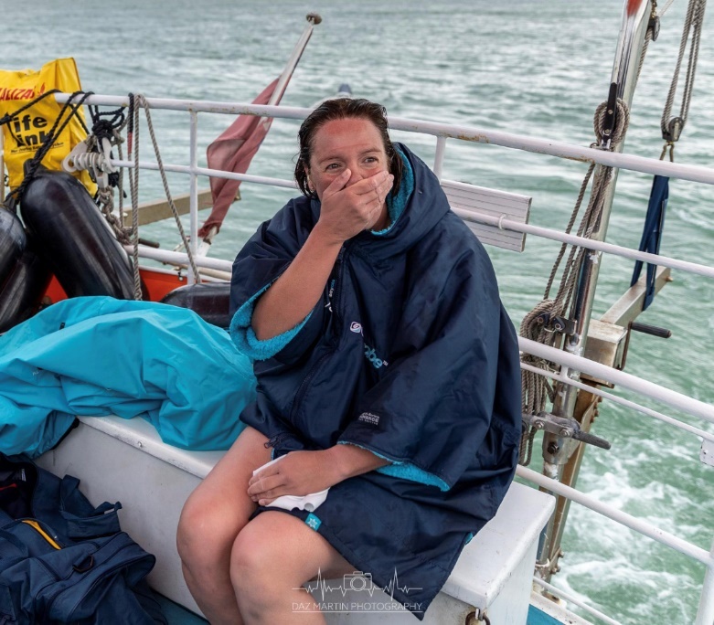 Verity Joyce pictured in a boat after swimming the channel