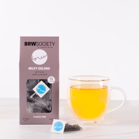 A glass of beer next to a box of cigarettesDescription automatically generated with low confidence
