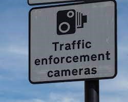 Traffic enforcement camera sign