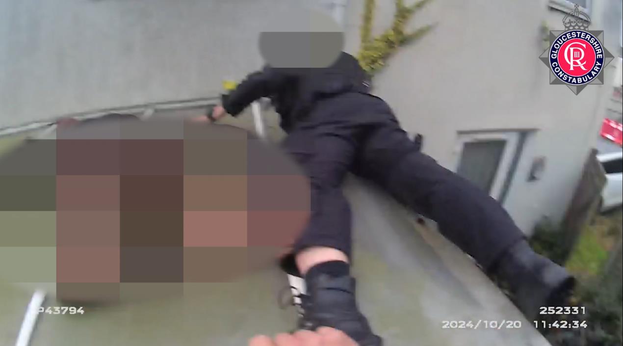 Still image of officer on fragile roof