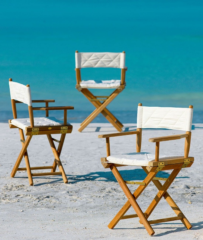 A group of chairs on a beachAI-generated content may be incorrect.
