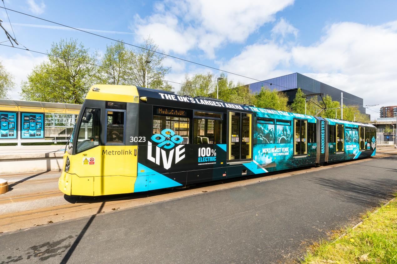 Metrolink tram in Co-op Live wrap