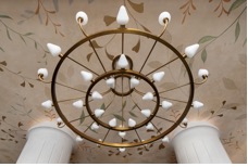 A chandelier from a ceilingAI-generated content may be incorrect.