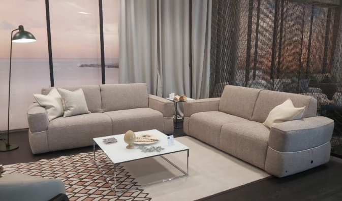 A living room with couches and a coffee tableAI-generated content may be incorrect.