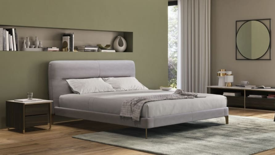 A bed in a roomAI-generated content may be incorrect.