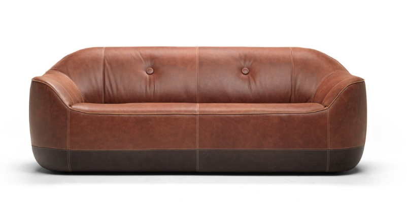 A brown leather couch with buttonsDescription automatically generated