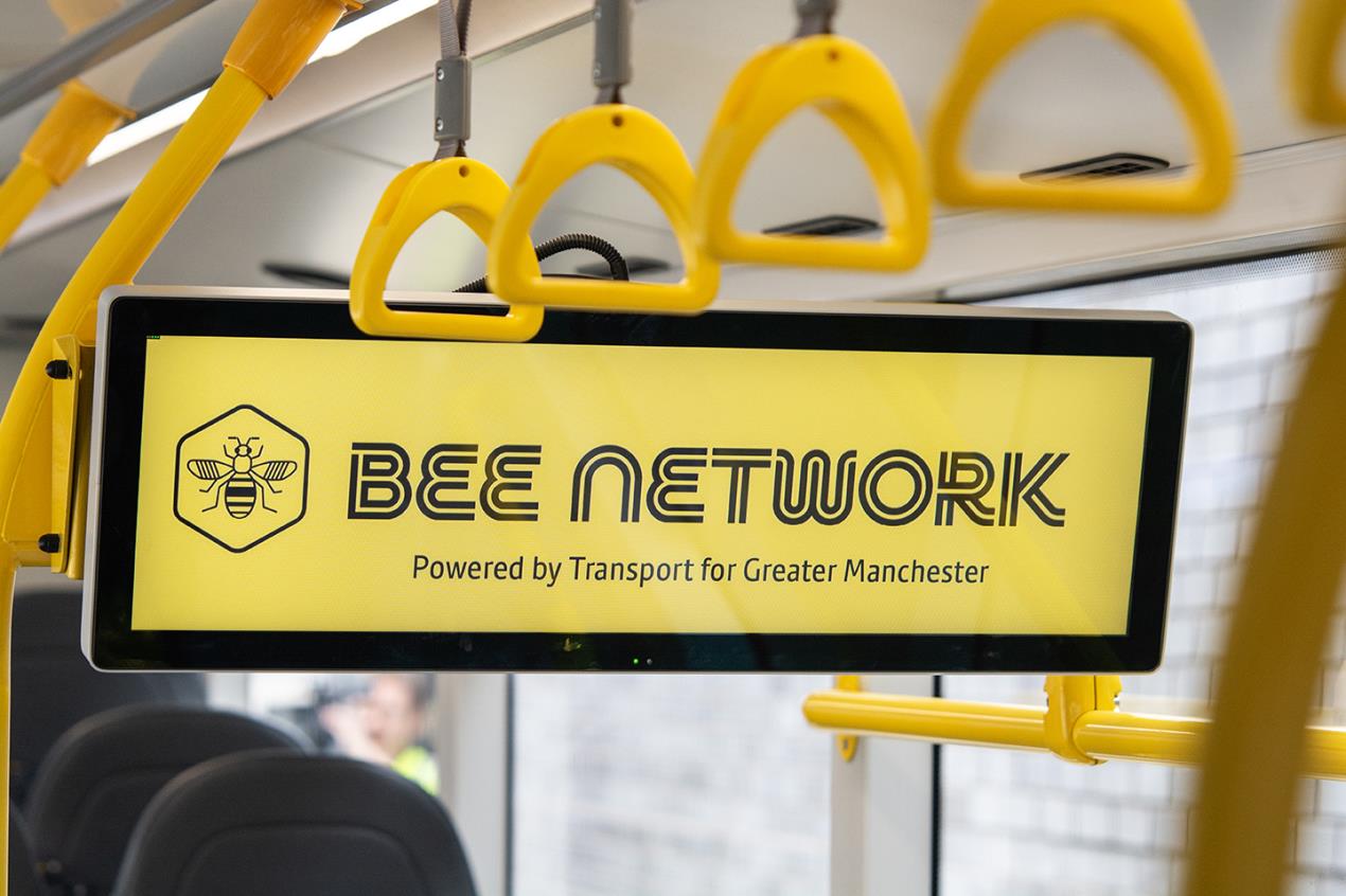 A Bee Network bus information internal display board with the Bee Network logo.