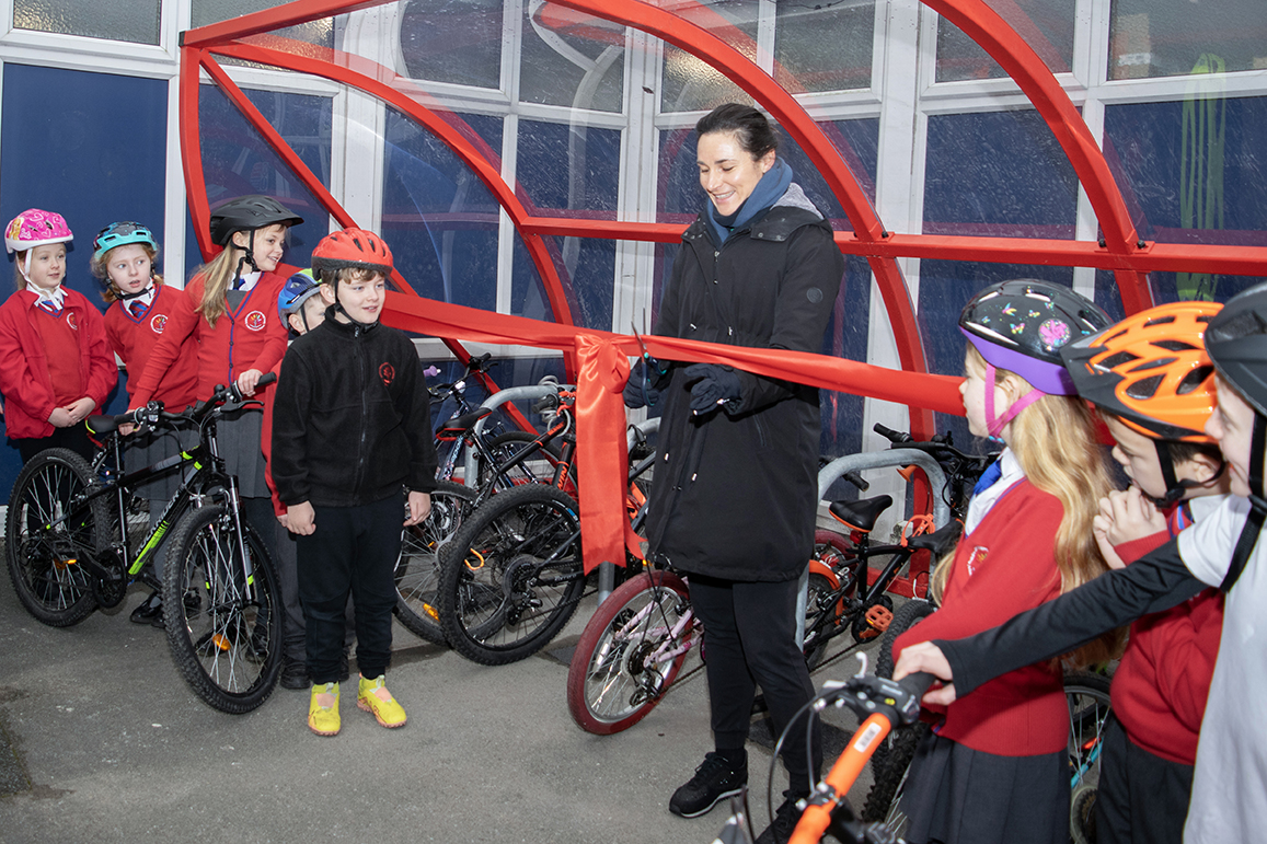 Dame Sarah Storey cuts the ribbon on the cycle store Arlies Primary 