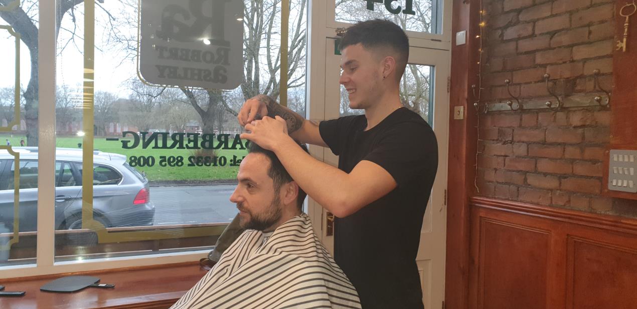 Barbering apprentice Sam Winson with boss Robert Ashley