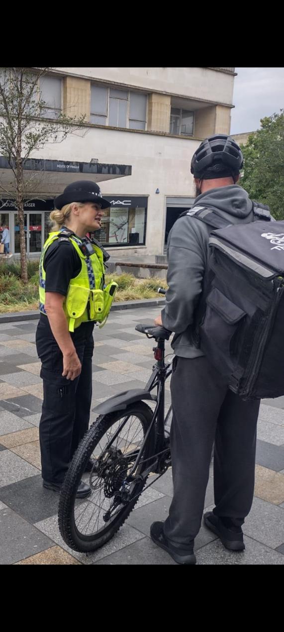 officer with cyclist