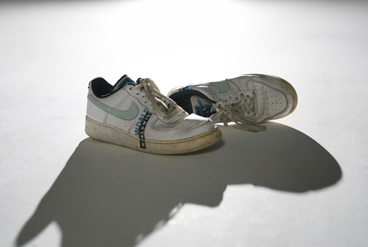 The shoes Marcus was wearing on the night of the collision, signifying his 'Last Steps' 