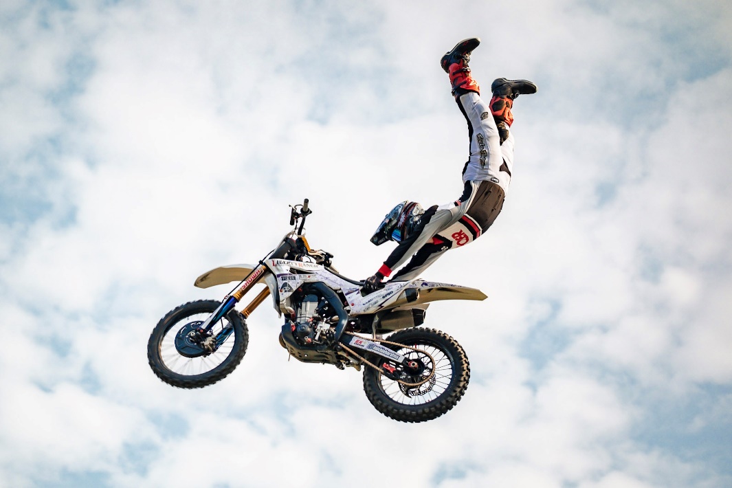A person on a motorcycleDescription automatically generated