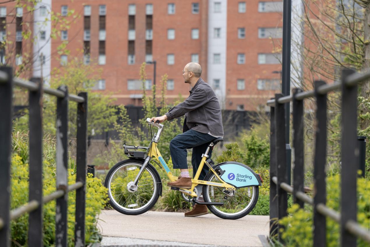 A man riding a Starling Bank Bike