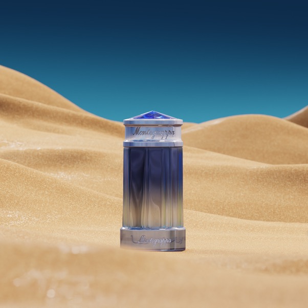 A blue and silver container in the sandDescription automatically generated