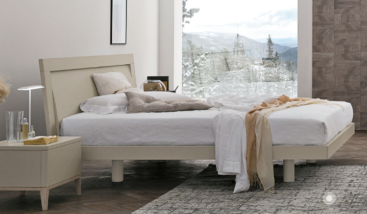 A bed with a view of the mountainsAI-generated content may be incorrect.