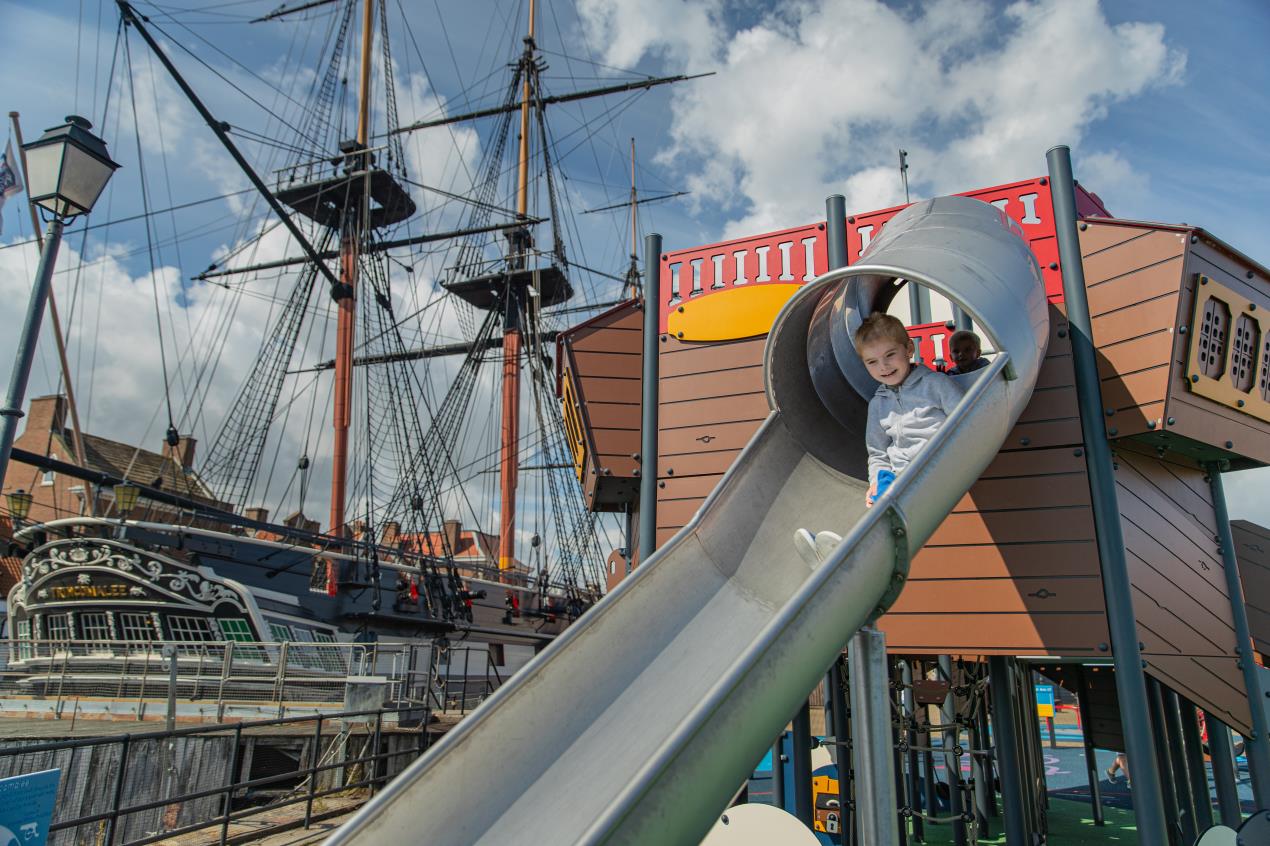 Child enjoys the playground next to HMS Trincomalee - Credit NMRN Child enjoys the playground next to HMS Trincomalee - Credit NMRN
