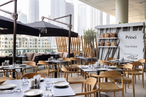 A restaurant with tables and chairsAI-generated content may be incorrect.