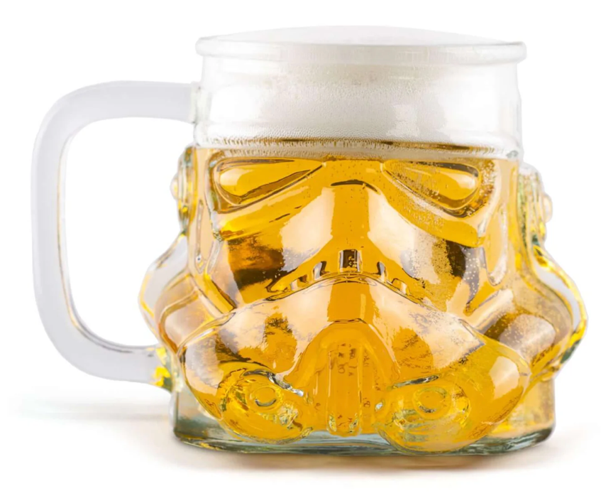 A glass mug with a face mask on itDescription automatically generated