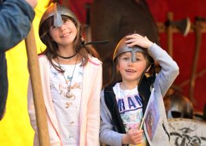 Trying on Viking helmets at the re-opening of JORVIK Viking Centre