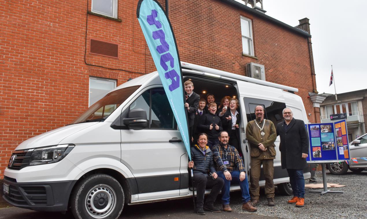 First look at YMCA East Surrey's new Y bus. Left to right: Ian Burks, CEO, YMCA East Surrey, Stuart Kingsley Family Services and Youth Work Manager, YMCA East Surrey, Cllr James Baker, Deputy Mayor, Reigate & Banstead Borough Council, Cllr Richard Biggs, Leader, Reigate & Banstead Borough Council
