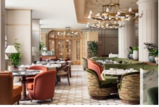 A restaurant with tables and chairsAI-generated content may be incorrect.