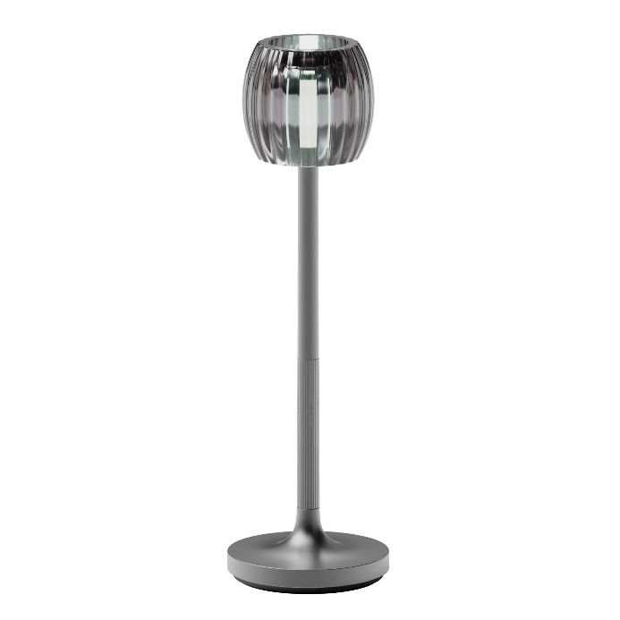 A silver lamp with a round baseDescription automatically generated