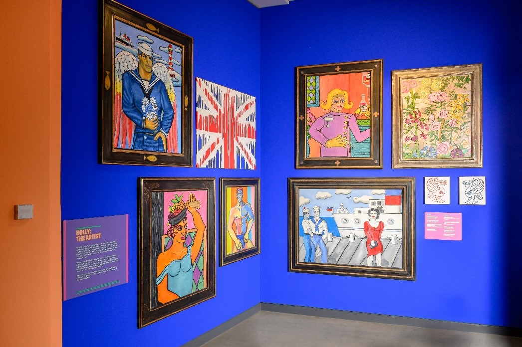 A wall with pictures on itDescription automatically generated