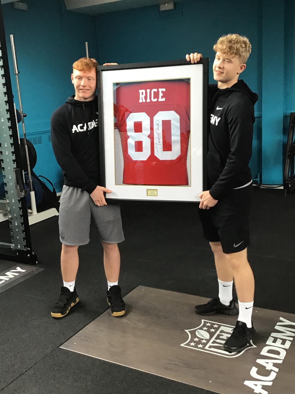 NFL Students at Barnet and Southgate College with the framed Jerry Rice shirt