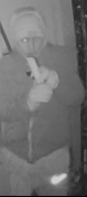 Doorbell footage of man in hat and hoodie