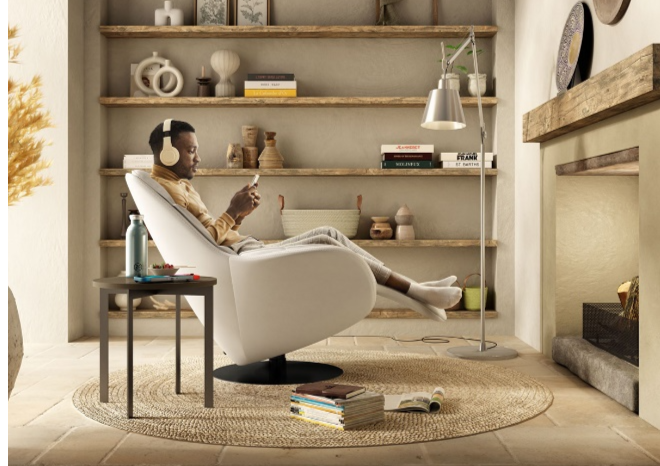 A person sitting in a chairDescription automatically generated