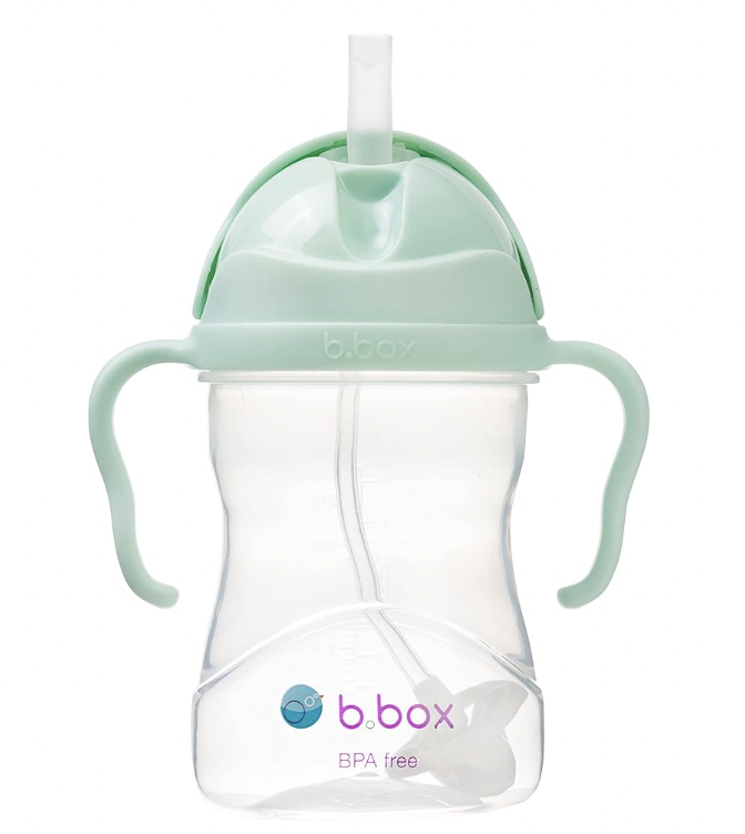 A baby bottle with a strawDescription automatically generated