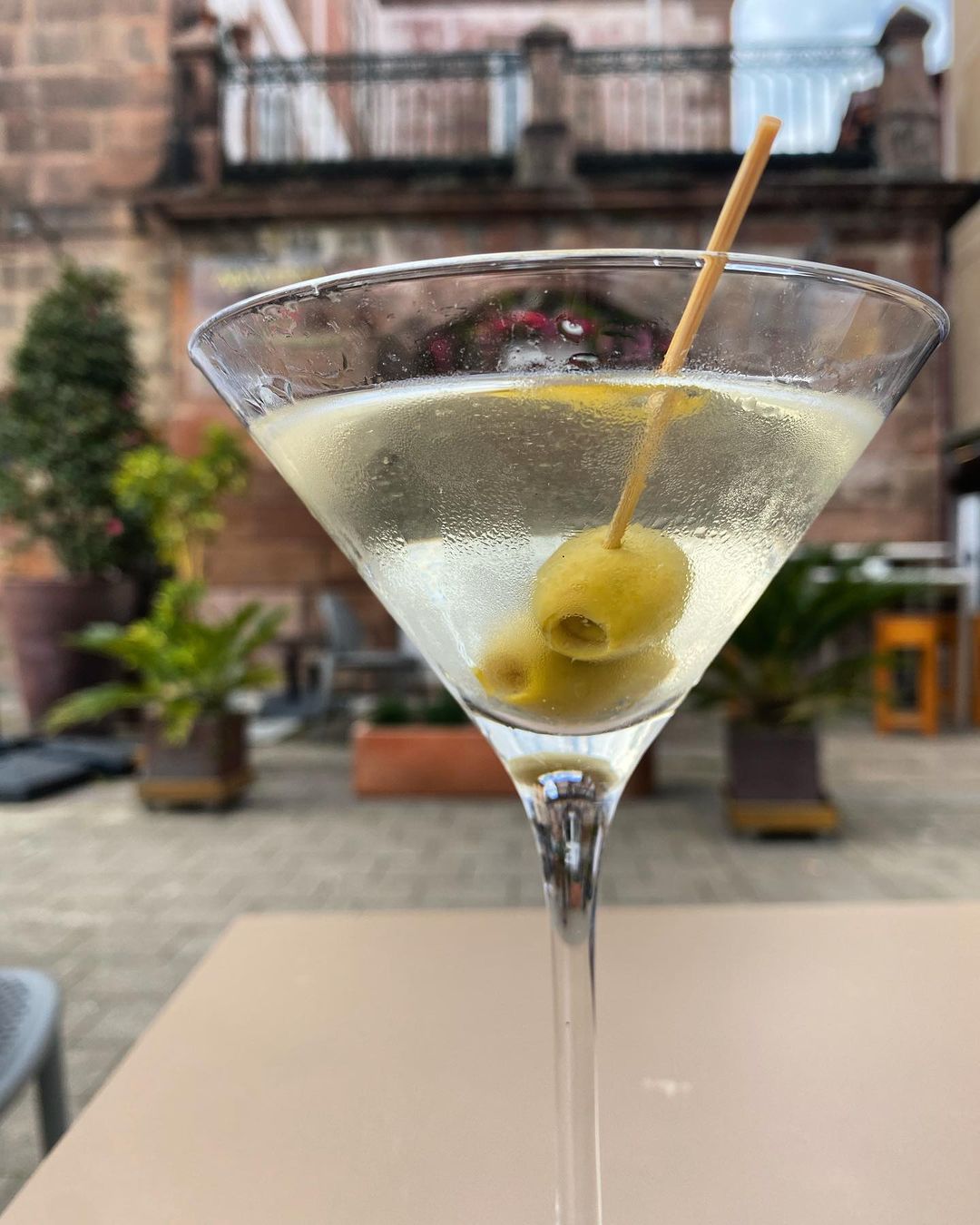 Here's What a Martini Should Look Like - Clear Liquid With an olive in it!