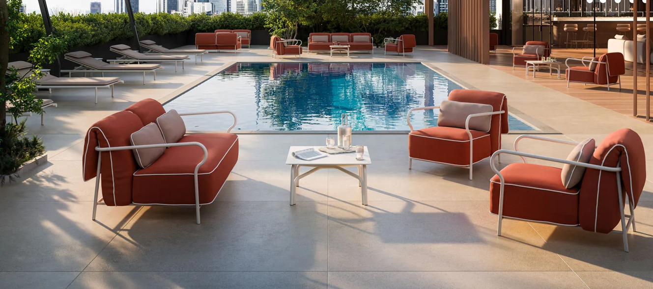 A pool with chairs and a tableAI-generated content may be incorrect.