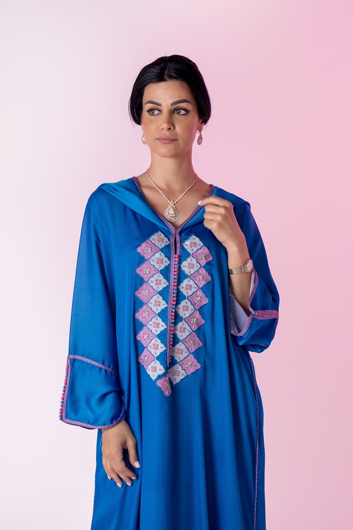 A person in a blue dressDescription automatically generated with medium confidence