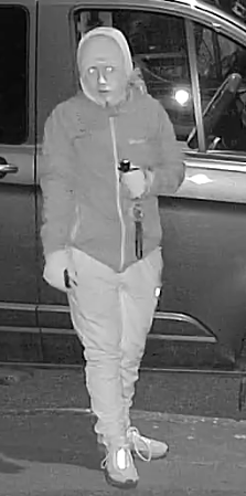 Doorbell footage of man in hat and hoodie