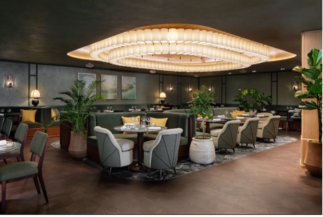 A restaurant with tables and chairsAI-generated content may be incorrect.