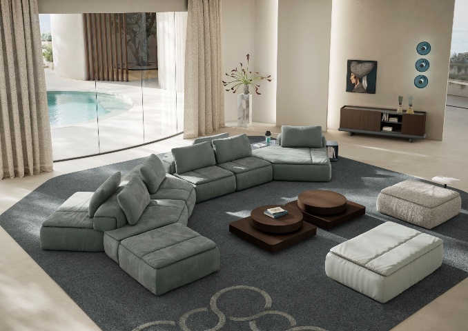 A living room with a large sofa and a poolAI-generated content may be incorrect.