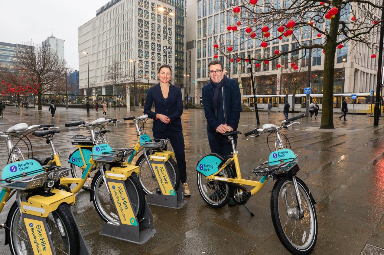 Dame Sarah Storey and Andy Burnham with the newly branded Starling Bank Bikes